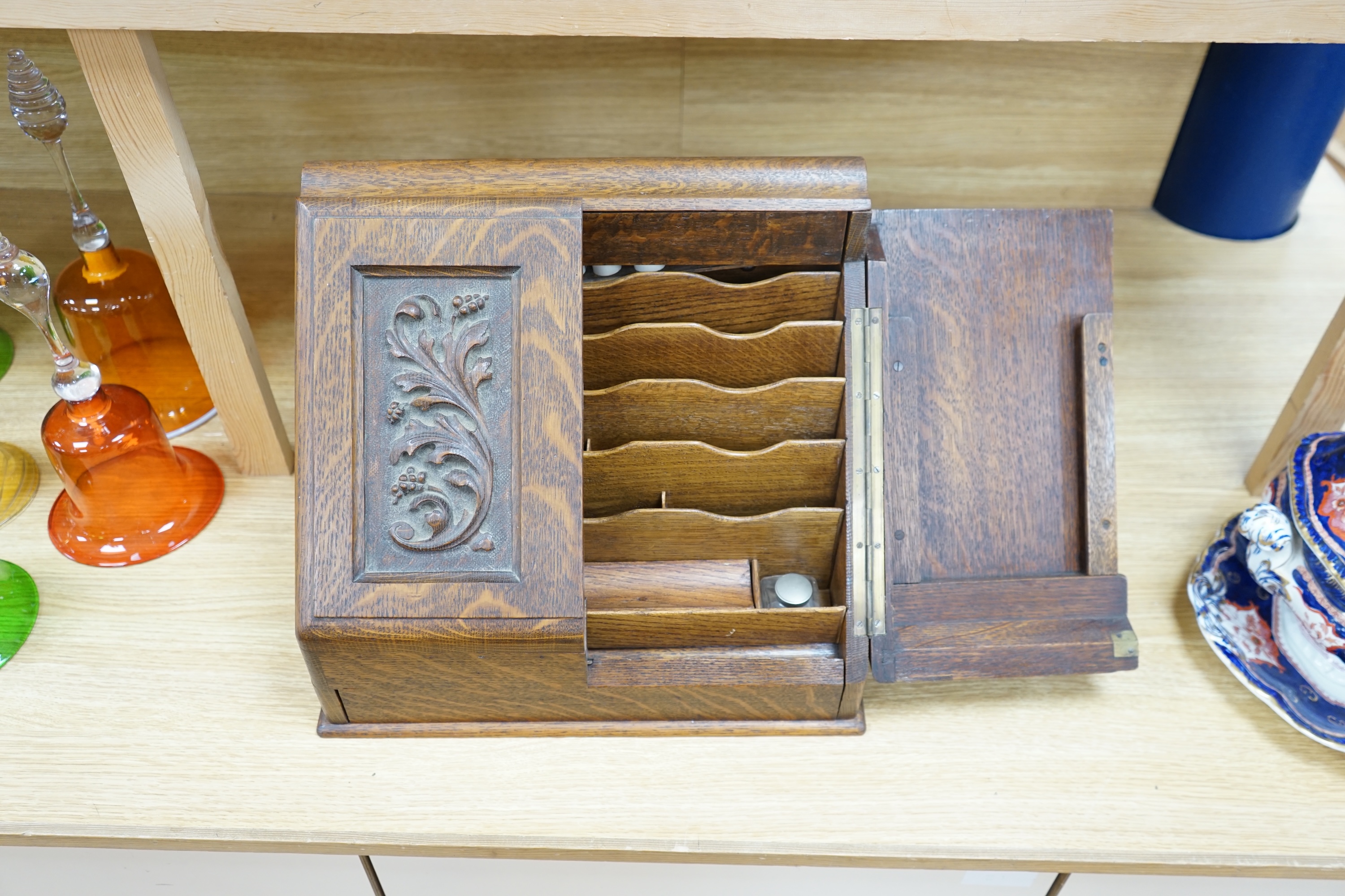 A Victorian carved oak stationery box, 33cm tall. Condition - good